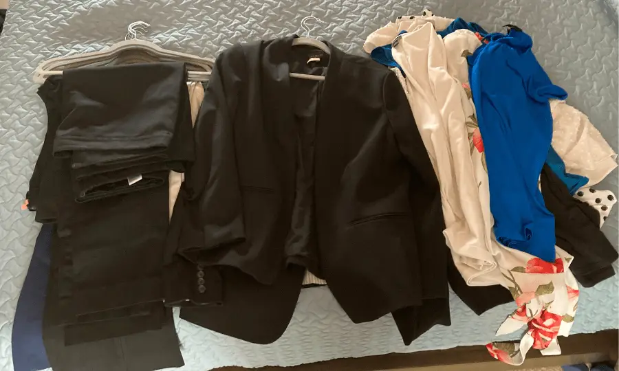 Image of slacks, blazers, and blouses to sort through.