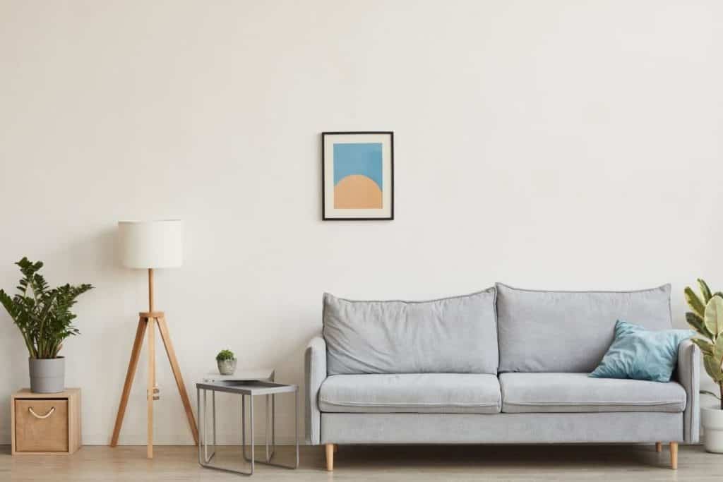 small couch in a minimalistic looking space with modest decor