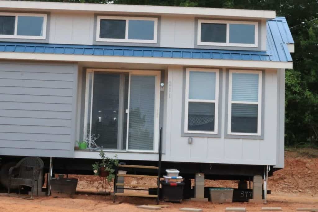 tiny home with a foundation on concrete blocks that aren't covered yet